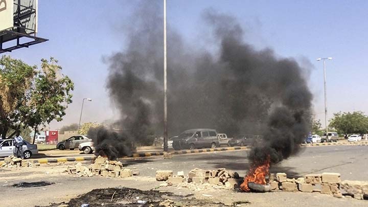 Protesters gathered to build new roadblocks in Khartoum, but riot police fired tear gas at them.