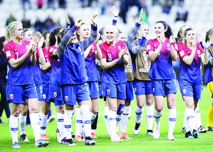 Norway players celebrate after the Women's World Cup Group A soccer match between Norway and Nigeria at stadium Auguste Delaune in Reims, France on Saturday. Norway defeated Nigeria 3-0.