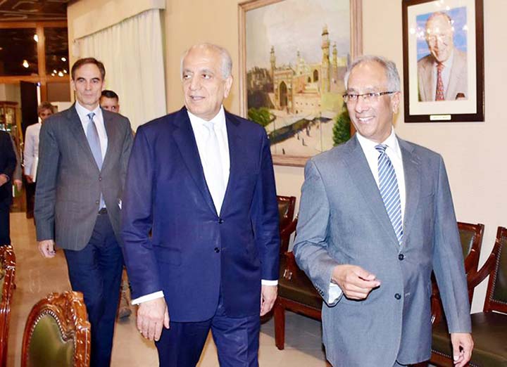 Pakistan's Foreign Ministry official Aftab Khokhar (right) escorts visiting Special Representative for Afghanistan Reconciliation Zalmay Khalilzad (center) for talks at the Foreign Office in Islamabad, Pakistan on Sunday. AP file photo
