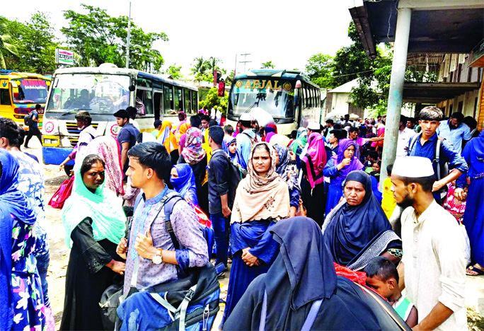 Hundreds of Eid holidaymakers face immense sufferings due to lack of transports after returning from village homes. This photo was taken from in front of Aricha Ghat on Monday.