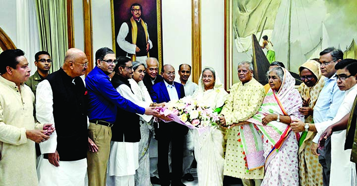 General Secretary of Bangladesh Awami League and Road Transport and Bridges Minister Obaidul Quader along with party colleagues greet AL President and Prime Minister Sheikh Hasina with bouquets at Ganabhaban on Tuesday marking the latter's Jail Release D