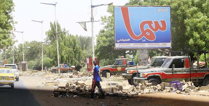 Fewer people than usual were on the streets of Khartoum, patrolled by heavily armed paramilitaries.