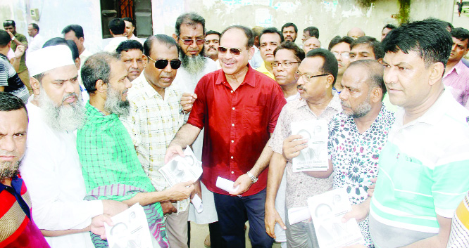 BOGURA: BNP and 20 -party Alliance nominated candidate of by -election of Bogura -6 seat Golum Mohammad Siraj conducting election campaign at Bogura town on Monday.