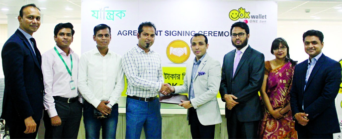 Gazi Yar Mohammed, Head of Mobile Financial Services and Agent Banking of ONE Bank Ltd and MM Al Farooque Shubho, Co-Founder and CEO of Zantrik, exchanging an agreement signing document at the Corporate Office of the Bank recently. Under the deal, OK Wall