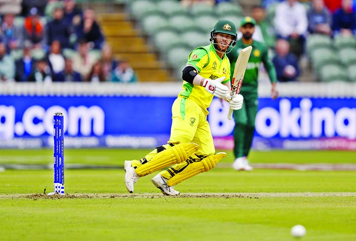 Australia's David Warner hits 4 runs off the bowling of Pakistan's Shaheen Afridi during the ICC World Cup Cricket match between Australia and Pakistan at the County Ground in Taunton, south west England on Wednesday. David Warner made 107, which guided