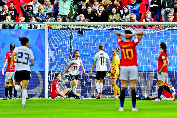 Germany's Sara Daebritz (center) celebrates after scoring the opening goal during the Women's World Cup Group B soccer match between Spain and Germany at Stade du Hainau in Valenciennes, France on Wednesday,. Daebritz scored once in Germany's 1-0 victo