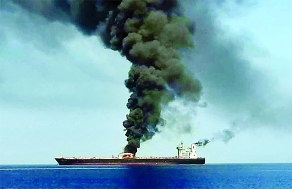 A picture obtained by AFP from Iranian State TV IRIB on June 13, 2019 reportedly shows smoke billowing from a tanker said to have been attacked off the coast of Oman.