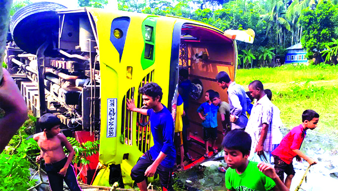 A passenger bus 'Green Line Paribahan' overturned in to a roadside ditch at Uzirpur in Pirojpur on Friday killing one passenger on the spot.