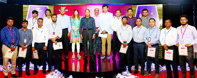 Walton Group's higher officials pose for a group photo with the awardees at 'TV Branding Award' held at the local brand's Corporate Office in the capital on Wednesday.