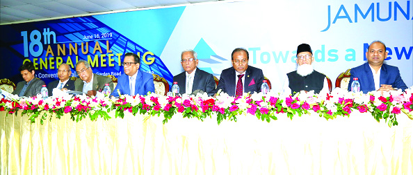 Engr Md Atiqur Rahman, Chairman of the Board of Directors of Jamuna Bank Ltd, presiding over the Bank's 18th Annual General Meeting at the Police Convention Center in the city on Sunday. Jamuna Bank Foundation Chairman Al-Haj Nur Mohammed, Managing Direc