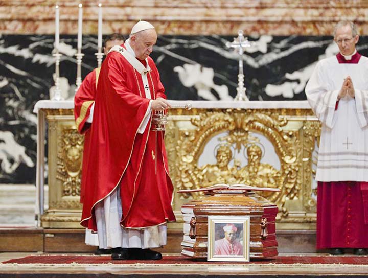 Pope Francis blesses the coffin as he celebrates the funeral service of Cardinal Leon Kalenga Badikebele, the Apostolic nuncio in Argentina, in St. Peter's Basilica at the Vatican on Saturday.