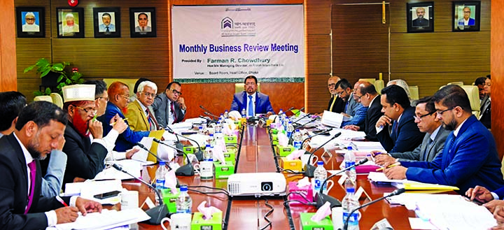 Farman R Chowdhury, Managing Director of Al-Arafah Islami Bank Ltd, presiding over a monthly business review meeting at the Head Office of the Bank in the city on Tuesday. Deputy Managing Directors Md Fazlul Karim, S M Jaffar, Mohammed Zubair Wafa, Shabbi