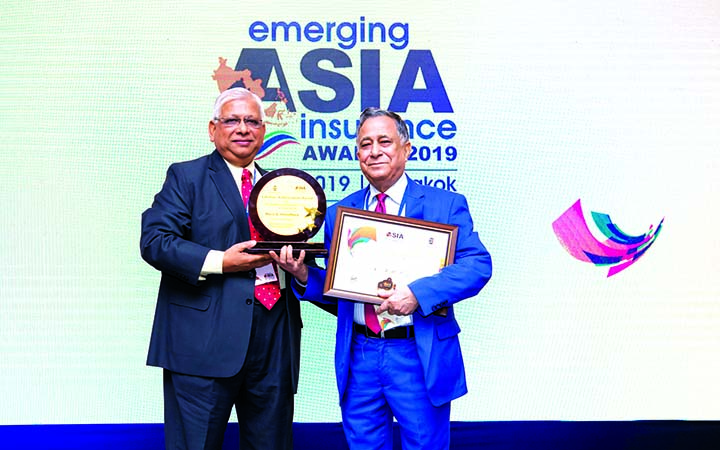Nasir A Choudhury, Founding Managing Director of Green Delta Insurance Company Ltd, receiving crest and certificate from a representative of Indian Chamber of Commerce at Hotel Holiday Inn at Bangkok in Thailand recently. Green Delta Insurance Company Ltd