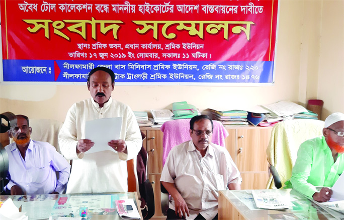 SAIDPUR(Nilphamari): Akhter Hossain Badal, President of Nilphamari District Bus- Minibus Workers Union reading a written statement on illegal toll collection at Nilphamari District Bus-Minibus Workers Union Office at Saidpur Central Bus Terminal on Mon