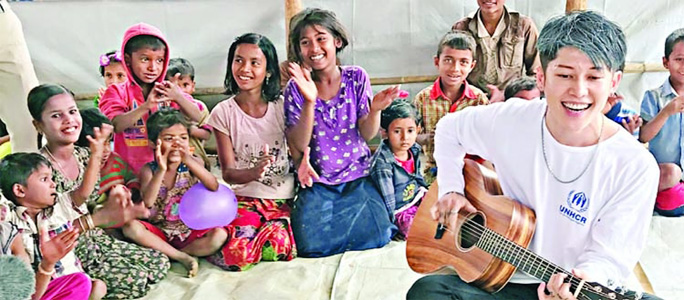 UNHCR Goodwill Ambassador and Japanese singer Miyavi singing among the Rohingya children during his visit to Cox's Bazar Rohingya camp on Monday.