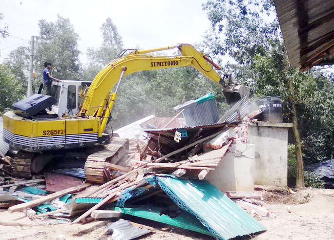 Mobile Court evicting illegal constructions from Islamnagar in Chakoria Upazila on Tuesday.