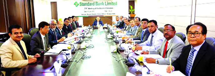 Kazi Akram Uddin Ahmed, Chairman of the Board of Directors of Standard Bank Ltd, presiding over the Bank's 314th Board Meeting at its head office in the city on Wednesday. Vice-Chairman Al-Haj Mohammed Shamsul Alam, Directors Kamal Mostafa Chowdhury, Ash