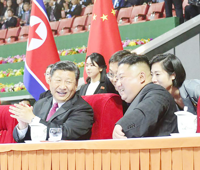 North Korean leader Kim Jong Un, right, and Chinese President Xi Jinping, left, watch a mass gymnastic performance at the May Day Stadium in Pyongyang, North Korea on Thursday.