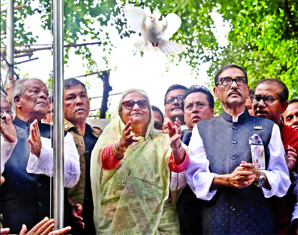 Prime Minister Sheikh Hasina places wreath at the portrait of Bangabandhu Memorial Museum at Dhanmondi-32 and she hoisted national and party flags and later releases of pigeons and balloons on Sunday.