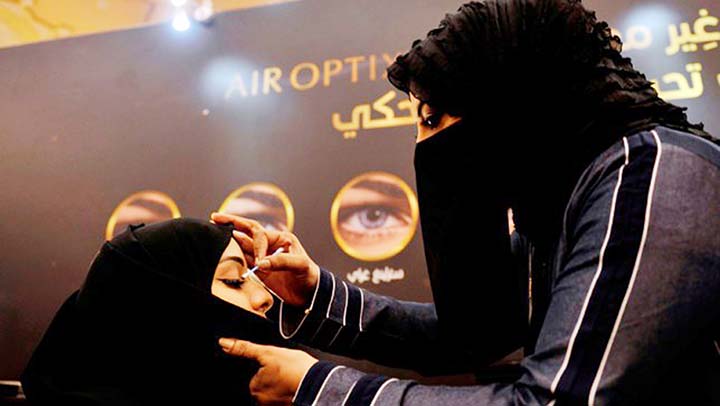 In this file photo taken on April 11, 2017 A beautician applies make-up on a Saudi woman at a bridal expo in the Red Sea city of Jeddah.