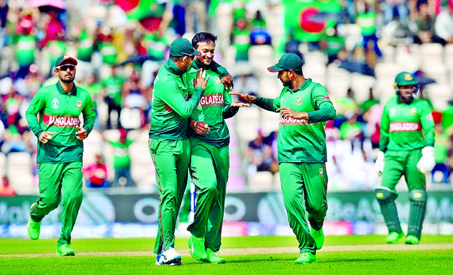 Bangladesh's Shakib Al Hasan (third from left) celebrates with his teammates after dismissal of Asghar Afghan during their match of the ICC World Cup Cricket between Bangladesh and Afghanistan at Southampton in England on Monday.