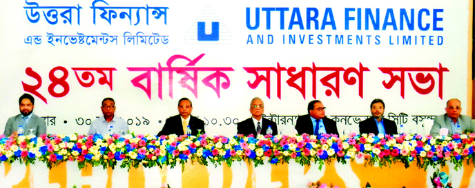 Rashidul Hasan, Chairman of Uttara Finance and Investments Ltd, presiding over its 24thAnnual General Meeting at the International Convention City Bashundhara in the capital on Sunday. Vice Chairman Matiur Rahman, Managing Director S M Shamsul Arefin, Dir