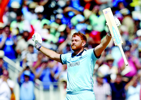 England's Jonny Bairstow celebrates scoring a century during the ICC World Cup Cricket match between England and India at Edgbaston in Birmingham, England on Sunday.