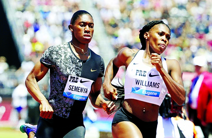 South Africa's Caster Semenya (left) runs next to United States' Chrishuna Williams during the women's 800-meter race during the Prefontaine Classic, an IAAF Diamond League athletics meeting in Stanford, Calif. Sunday. Semenya won the race.