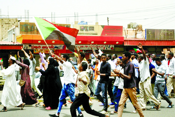 Sudanese protesters chant "Civilian rule"" during a mass demonstration against Sudan's ruling generals in the northern Khartoum district of Bahri."
