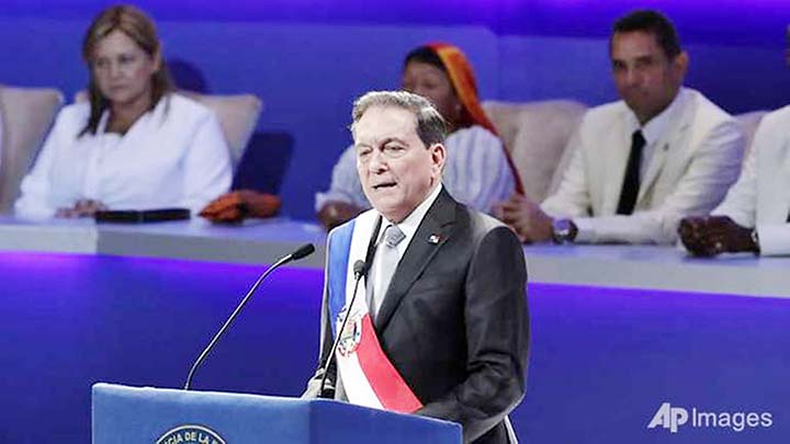 Panama's new President Laurentino Cortizo wears the presidential sash as he speaks during his inauguration ceremony in Panama City.