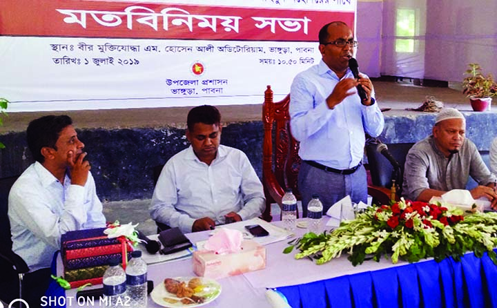 BHANGURA(Pabna): Kabir Mahmud, DC of Pabna speaking to public representatives, govt. officers, journalists and member of civil society in the Freedom Fighter Hossain Ali Auditorium at Bhangura Upazila on Monday.