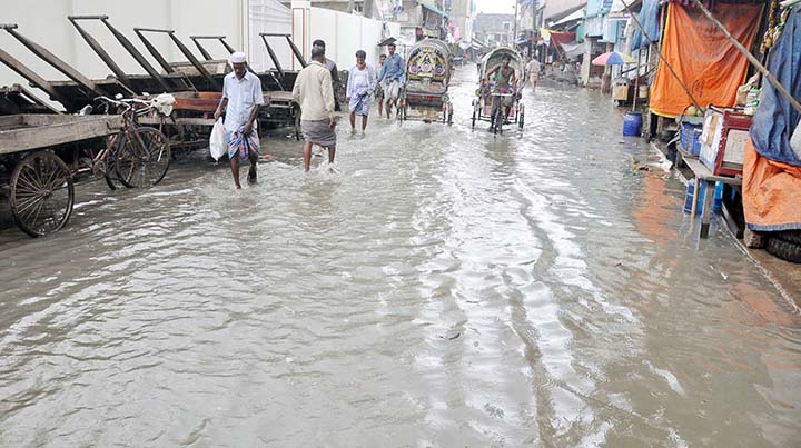 People at Chaktai Khatunganj area facing problems as the roads have been submerged due to tidal water . This snap was taken yesterday.