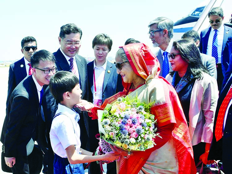 Visiting Prime Minister Sheikh Hasina was accorded a warm reception after arrival at Beijing Airport with a floral wreath on Wednesday. PID Photo