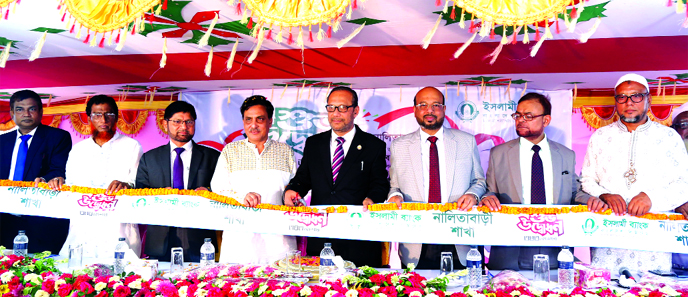 Md. Mahbub-ul-Alam, Managing Director of Islami Bank Bangladesh Ltd, inaugurating the Bank's 343rd Branch at Nalitabari in Sherpur on Thursday. Abu Reza Md Yeahia, Deputy Managing Director, Md Abdul Jabbar, Deputy Managing Director, Md Nurul Amin, Presid