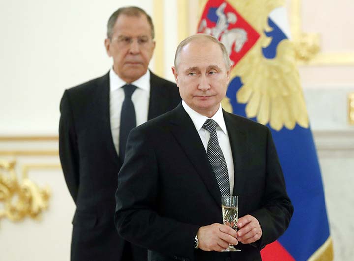 Russian President Vladimir Putin, center, and Russian Foreign Minister Sergei Lavrov attend a ceremony to receive credentials from newly appointed foreign ambassadors to Russia in Kremlin, Moscow, Russia on Wednesday.