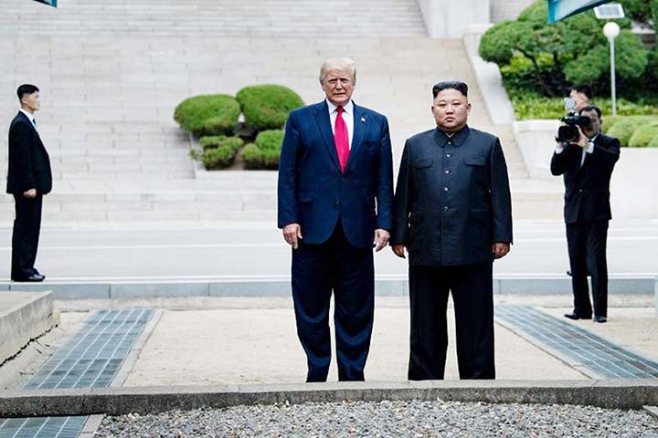 US President Donald Trump and North Korea's leader Kim Jong Un stand on North Korean soil while walking to South Korea in the Demilitarized Zone (DMZ) in Panmunjom AP file photo