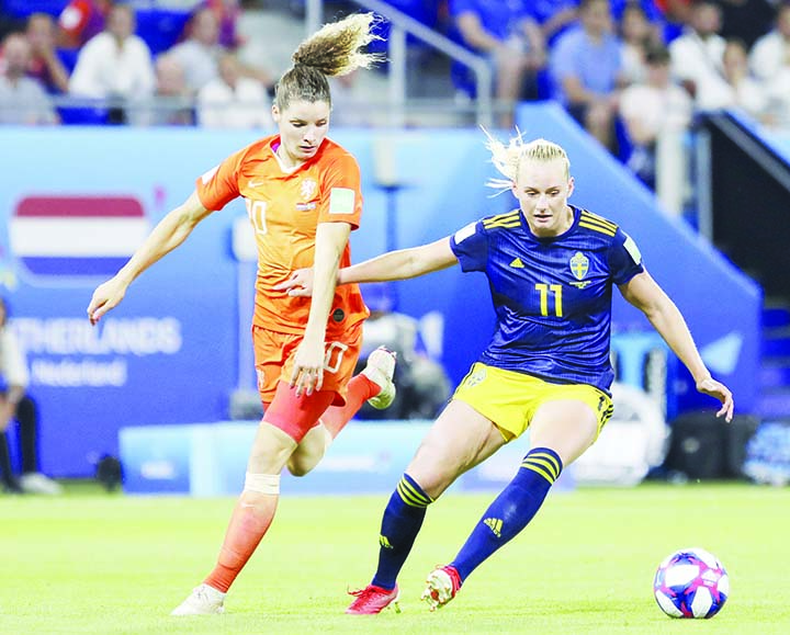Netherlands' Dominique Bloodworth (left) challenges Sweden's Stina Blackstenius (right) during the Women's World Cup semifinal soccer match between the Netherlands and Sweden at the Stade de Lyon outside Lyon, France on Wednesday.
