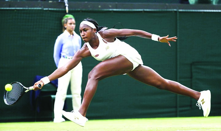 United States' Cori Coco Gauff returns to Slovakia's Magdalena Rybaikova in a Women's singles match during day three of the Wimbledon Tennis Championships in London on Wednesday.