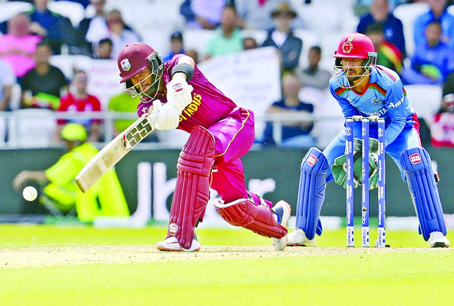 West Indies' Shai Hope (left) in action during the ICC World Cup Cricket match against Afghanistan at Leeds in England on Thursday. Hope scored his team's highest 77 runs.