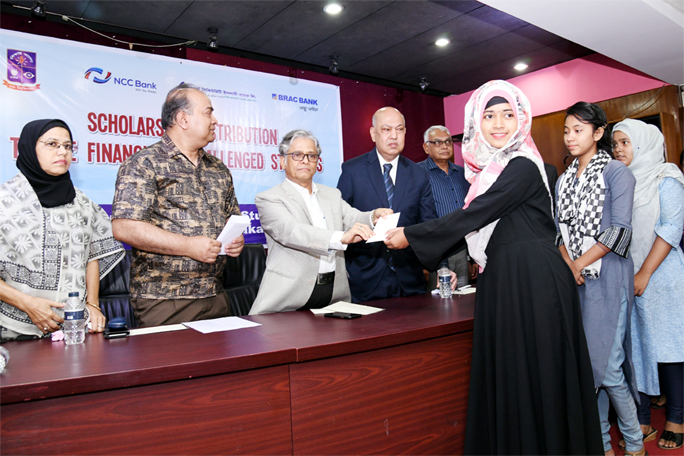 Dhaka University Vice-Chancellor Prof Dr Md. Akhtaruzzaman distributes scholarships among the financially challenged students of different departments under the Faculty of Business Studies of the University at a function at the conference room of Business