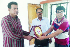 MANIKGANJ: Musfiqur Rahman Khan Hannan, Chairman, Singair Upazila giving crest to Md Altaf Hossain, PT teacher of Singair Govt High School for being selected as best scout teacher in Upazila level recently.