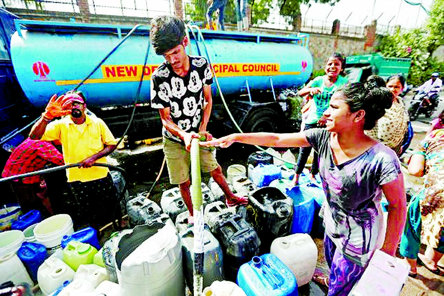 Residents fill their containers with drinking water from a municipal tanker in New Delhi. Internet photo