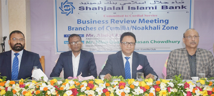 Abdul Aziz, Additional Managing Director of Shahjalal Islami Bank Ltd, addressing a Business Review Meeting with the officials of Noakhali Zone Branches at Cumilla Club recently. Mian Quamrul Hasan Chowdhury, Head of Human Resources Division and Md Abu Sh