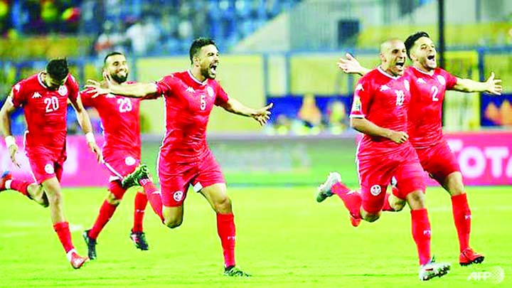 Tunisia's players celebrate their win against Ghana during the 2019 Africa Cup of Nations Round of 16 football match at Ismailia in Egypt on Monday.