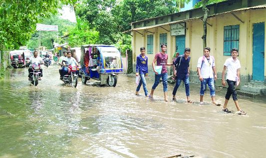 ULIPUR (Kurigram ): Water-logging has taken a serious turn at Poura town due to poor drainage system . This picture was taekn from Ulipurt- Nazimkhan Road yesterday.