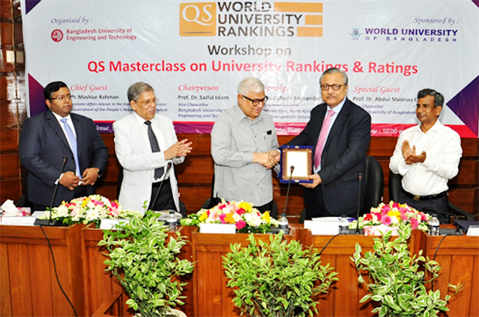 Dr Mashiur Rahman, Economic Affairs Adviser to the Prime Minister receives a memento at a workshop on University Rankings and Ratings organized by Bangladesh University of Engineering and Technology BUET at Council Building of the University on Tuesday.