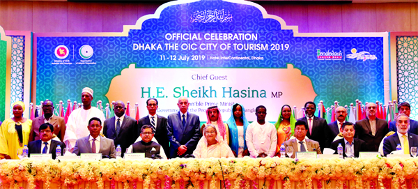 Prime Minister Sheikh Hasina poses for a photo session with the organisers and other distinguished persons in the inaugural ceremony of official celebration on 'Dhaka The OIC City of Tourism-2019' at a hotel in the city on Thursday.