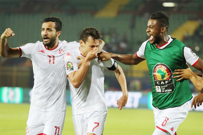 Tunisia players celebrates scoring their side's second goal during the 2019 Africa Cup of Nations quarter final match between Madagascar and Tunisia at the Al-Salam Stadium on Thursday.