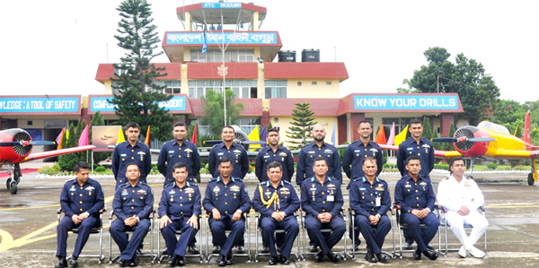 Chief of Air Staff Air Chief Marshal Masihuzzaman Serniabat poses for a photo session with the participants of BAF Flying Instructors' Course and Aviation Instructors' Post Graduation Diploma Course at FIS, Arulia Air Field, Bogura on Thursday.