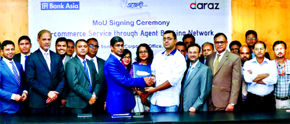 Md. Arfan Ali, Managing Director of Bank Asia and Sayed Mostahidal Hoq, Chairman of Daraz, a largest e-commerce platform in the country, are seen exchanging a Memorandum of Understanding (MoU) on providing e-commerce services for rural population through